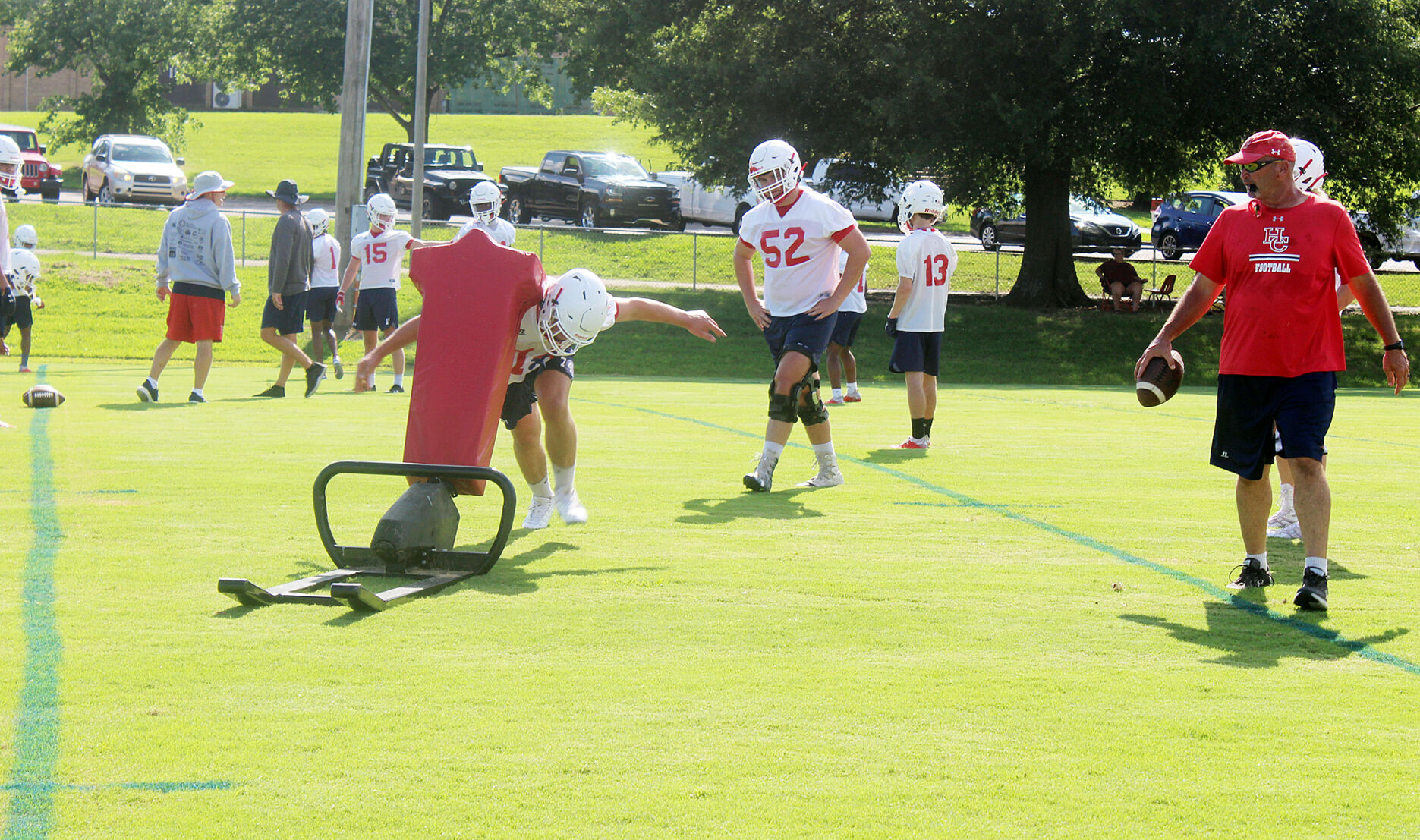 Practicing for a football season that’s shrouded in mystery